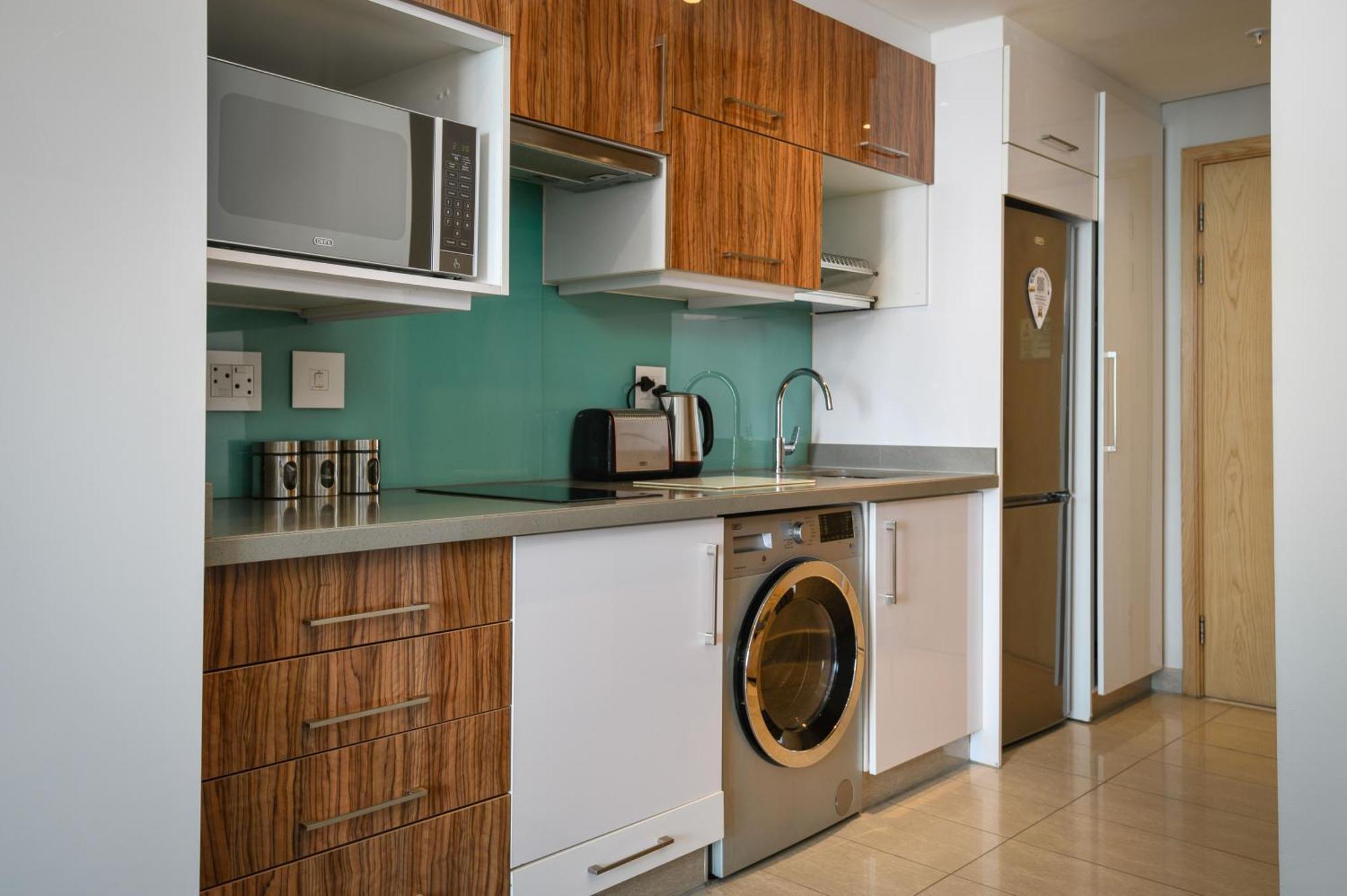 The Capital Pearls Hotel Durban Extérieur photo A typical kitchen in a serviced apartment
